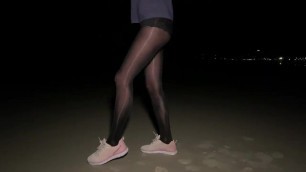 shiny black high waist pantyhose on night beach