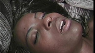 Dark skinned beauty swallows a huge black cock then rides it till it cums