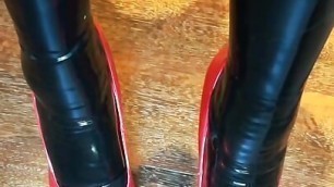 Alice Latexy models in stilettos and black and red latex (aka Latexdesires)